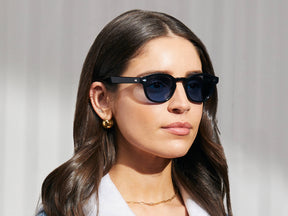 Model is wearing The LEMTOSH in Black in size 49 with BLUE⁺ Tinted Lenses