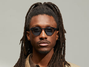 Model is wearing The LEMTOSH in Ink in size 46 with BLUE+ Tinted Lenses