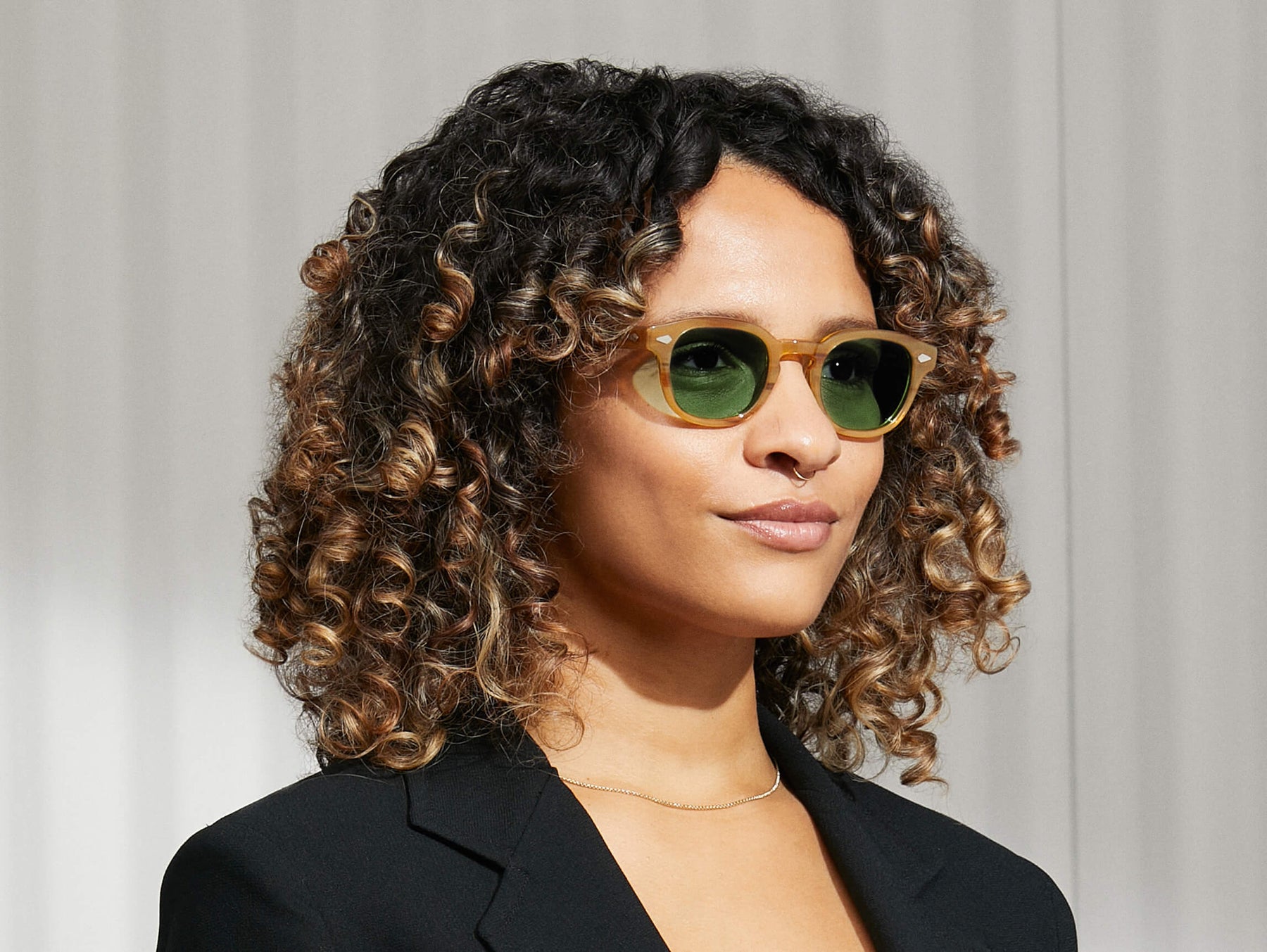 Model is wearing The LEMTOSH in Blonde size 46 with GREEN+ Tinted Lenses