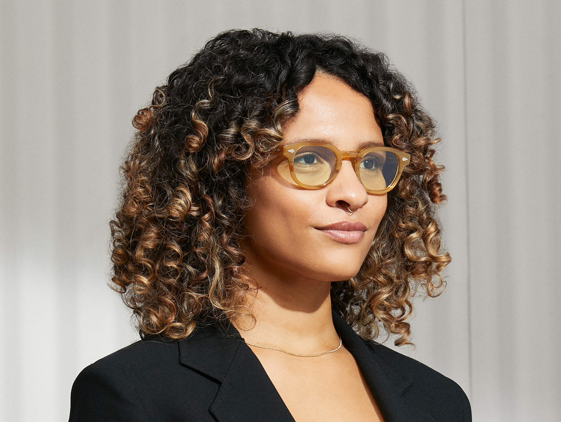 Model is wearing The LEMTOSH in Blonde size 46 with GREEN+ Tinted Lenses