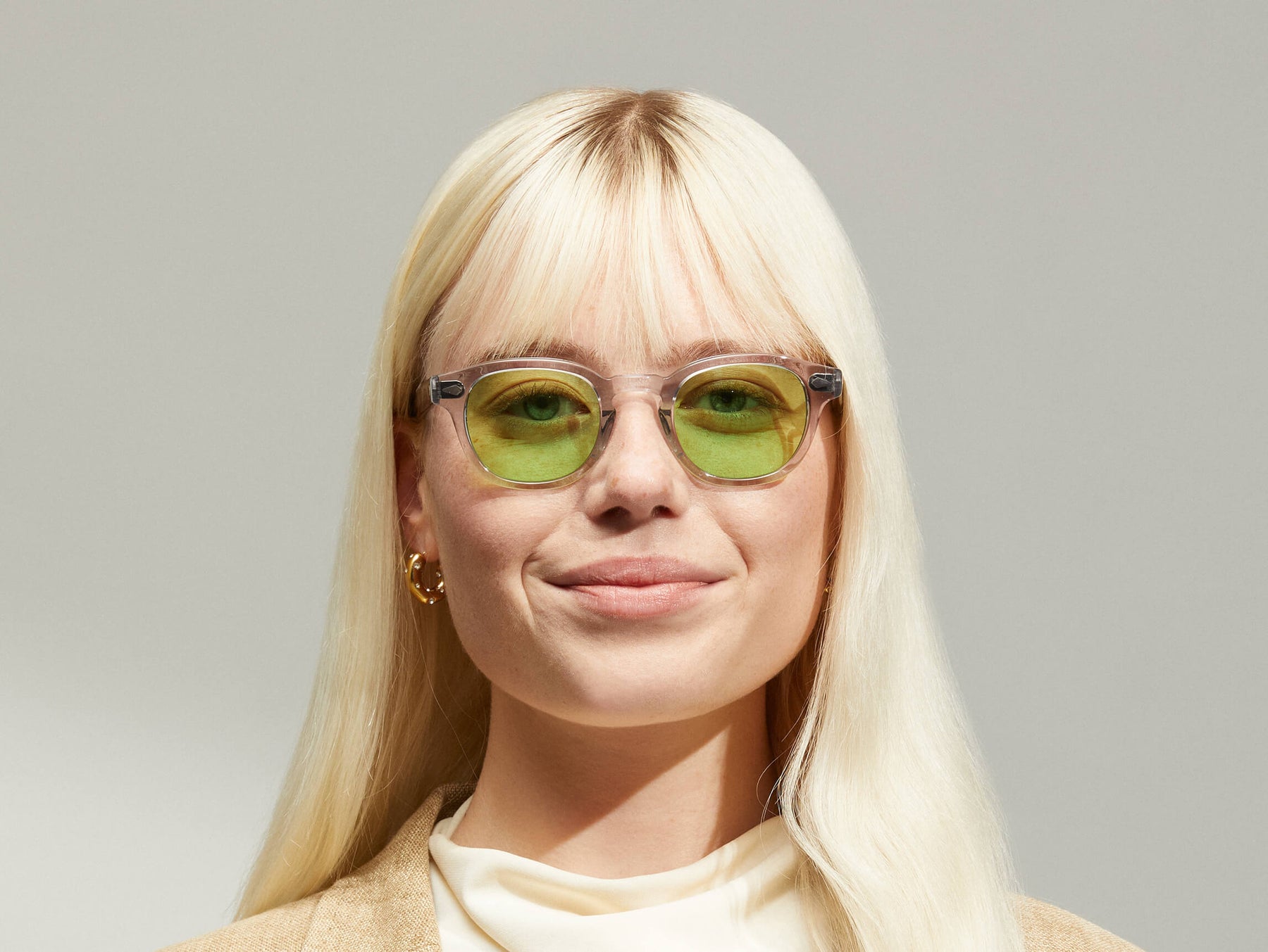 Model is wearing The LEMTOSH in Light Grey in size 46 with Garnet Green Tinted Lenses