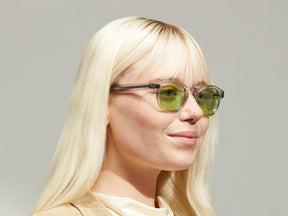 Model is wearing The LEMTOSH in Light Grey in size 46 with Garnet Green Tinted Lenses
