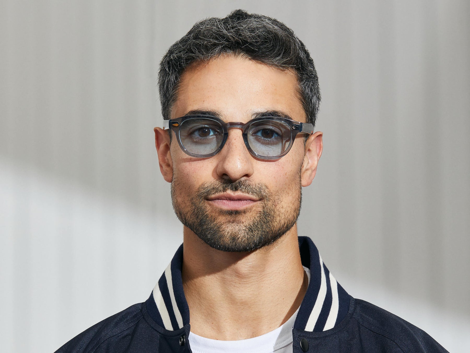 Model is wearing The LEMTOSH in Light Blue in size 46 with Bel Air Blue Tinted Lenses