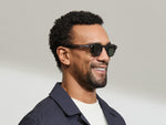 Model is wearing The LEMTOSH SUN-POLARIZED in size 46 in Grey with G-15 Glass Polarized Lenses