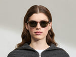 Model is wearing The LEMTOSH SUN-POLARIZED in size 49 in Brown Ash with G-15 Glass Polarized Lenses