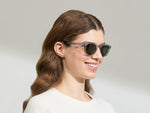 Model is wearing The LEMTOSH SUN-POLARIZED in size 49 in Light Grey with G-15 Glass Polarized Lenses