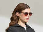 Model is wearing The LEMTOSH Brown Ash in size 49 with Cabernet Tinted Lenses