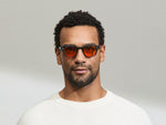 Model is wearing The LEMTOSH Ink in size 46 with Woodstock Orange Tinted Lenses