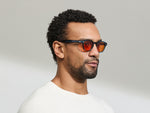 Model is wearing The LEMTOSH Ink in size 46 with Woodstock Orange Tinted Lenses