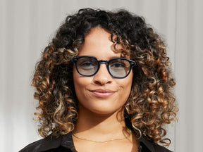 Model is wearing The LEMTOSH 110 in 110 Blue in size 49 with Bel Air Blue Tinted Lenses