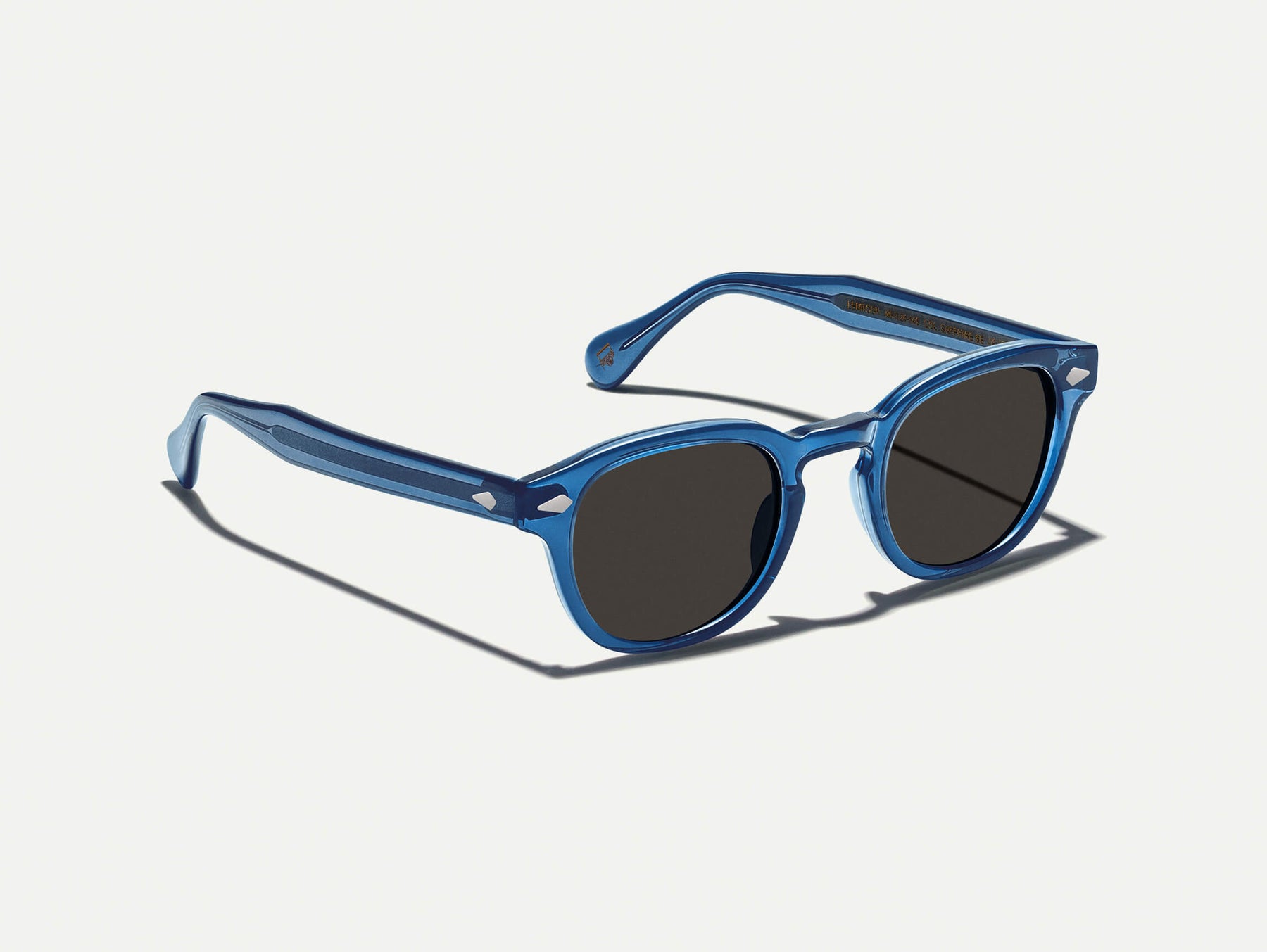 The LEMTOSH SUN in Sapphire with Grey Glass Lenses