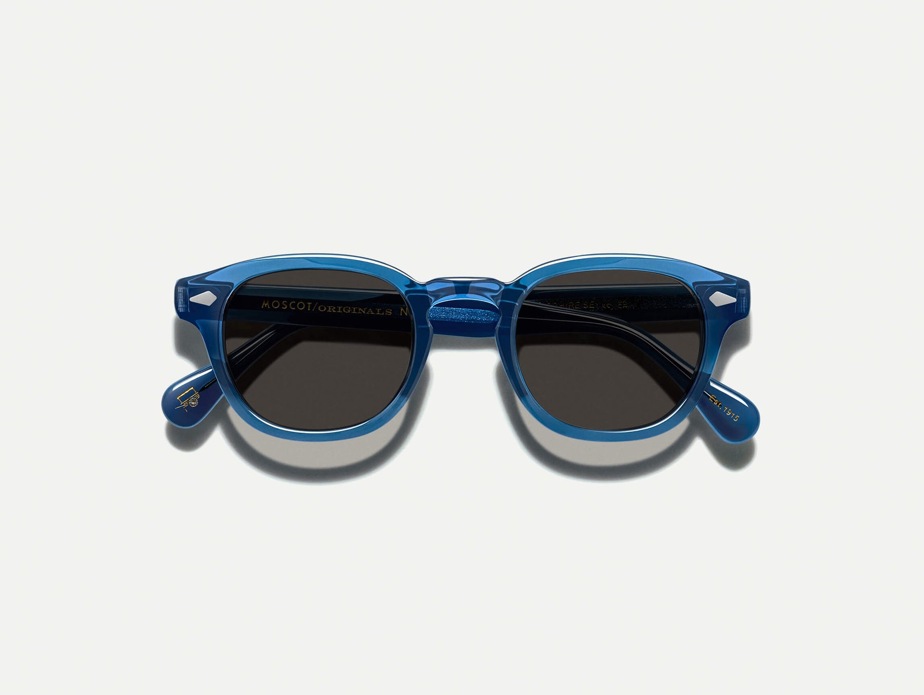 The LEMTOSH SUN in Sapphire with Grey Glass Lenses
