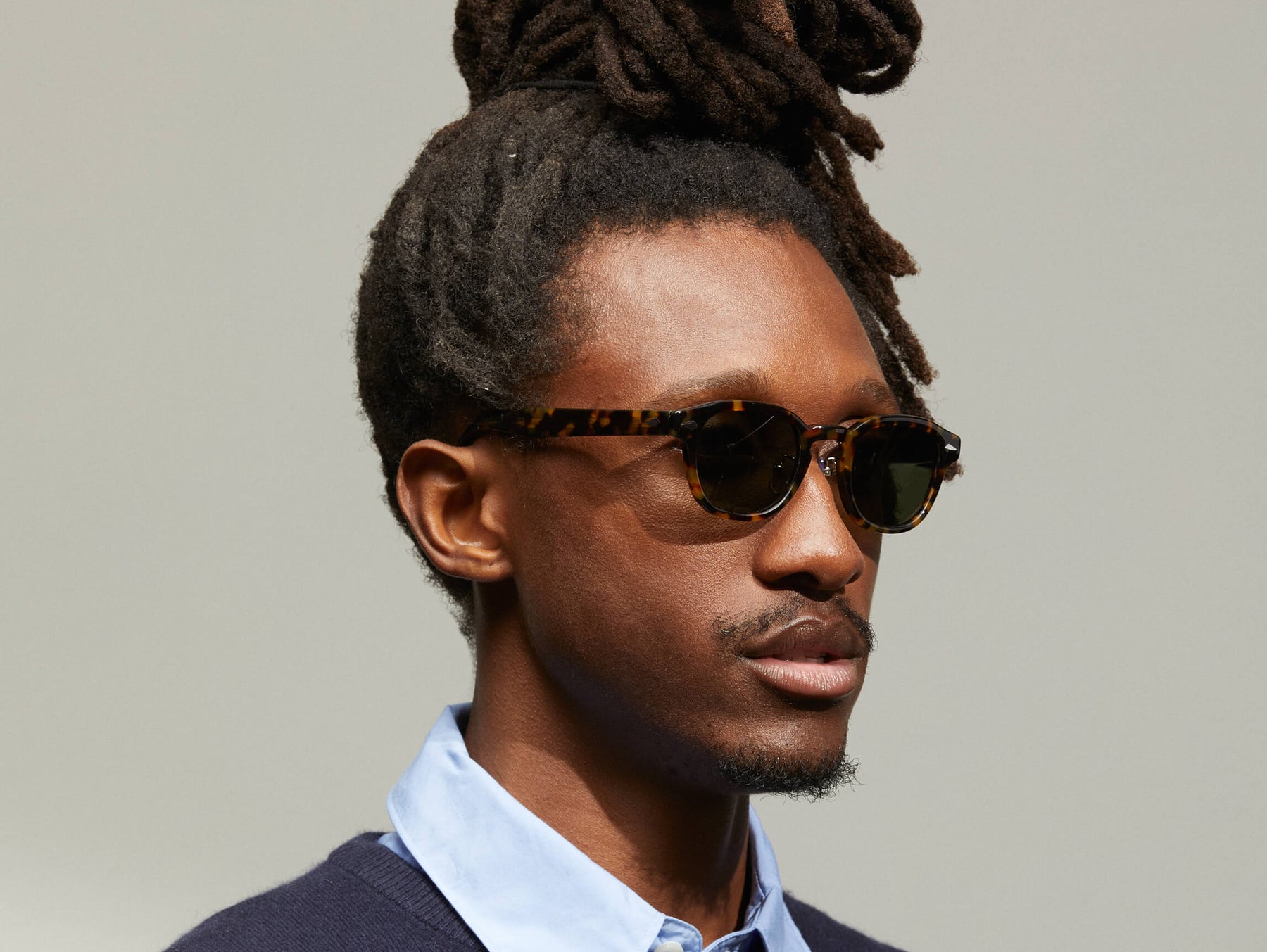 Model is wearing The LEMTOSH SUN with Metal Nose Pads in Tortoise in size 46 with G-15 Glass Lenses