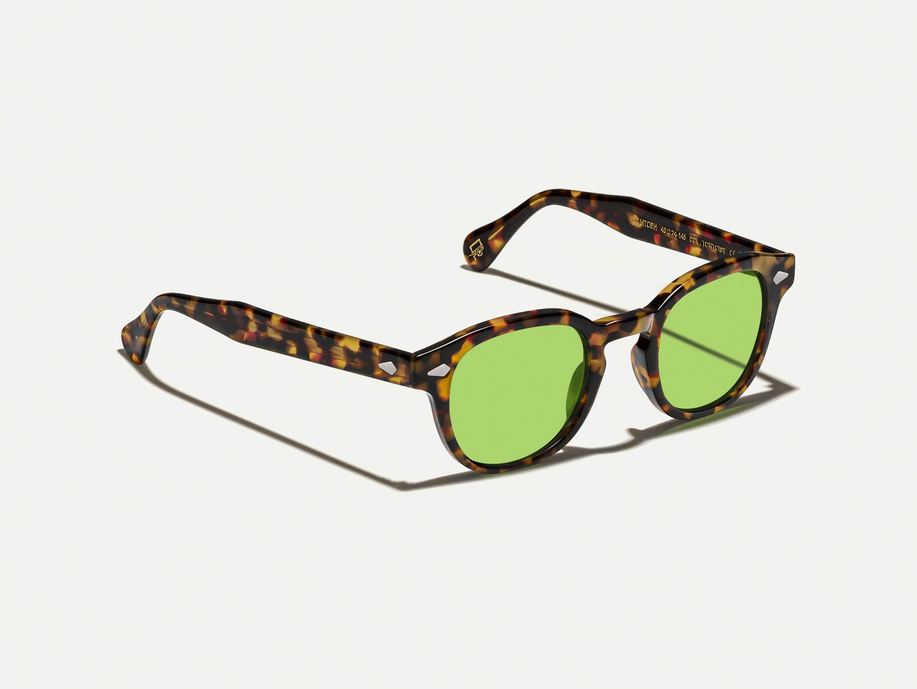 The LEMTOSH Tortoise with Garnet Green Tinted Lenses