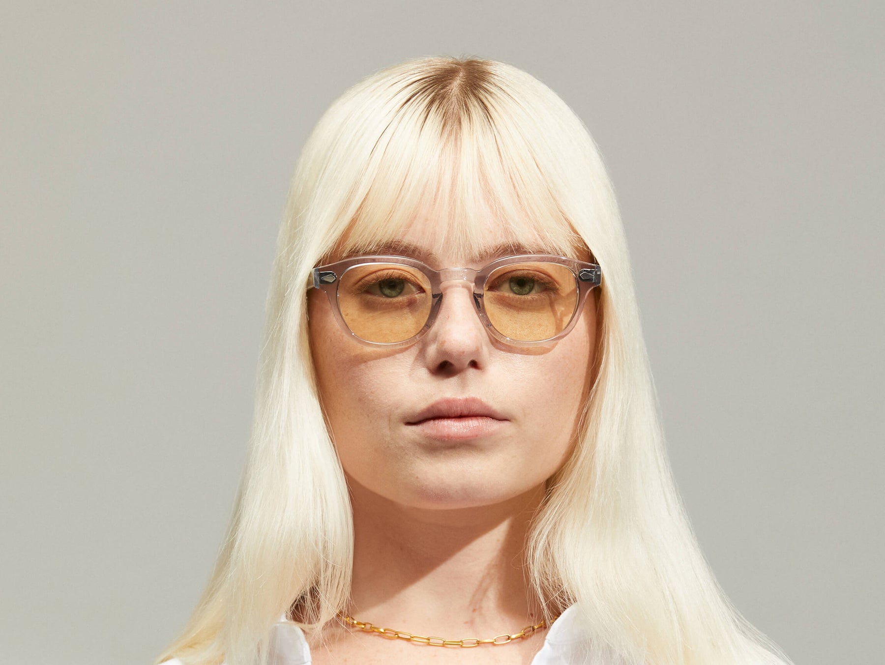 Model is wearing The LEMTOSH in Light Grey size 46 with AMBER+ Tinted Lenses
