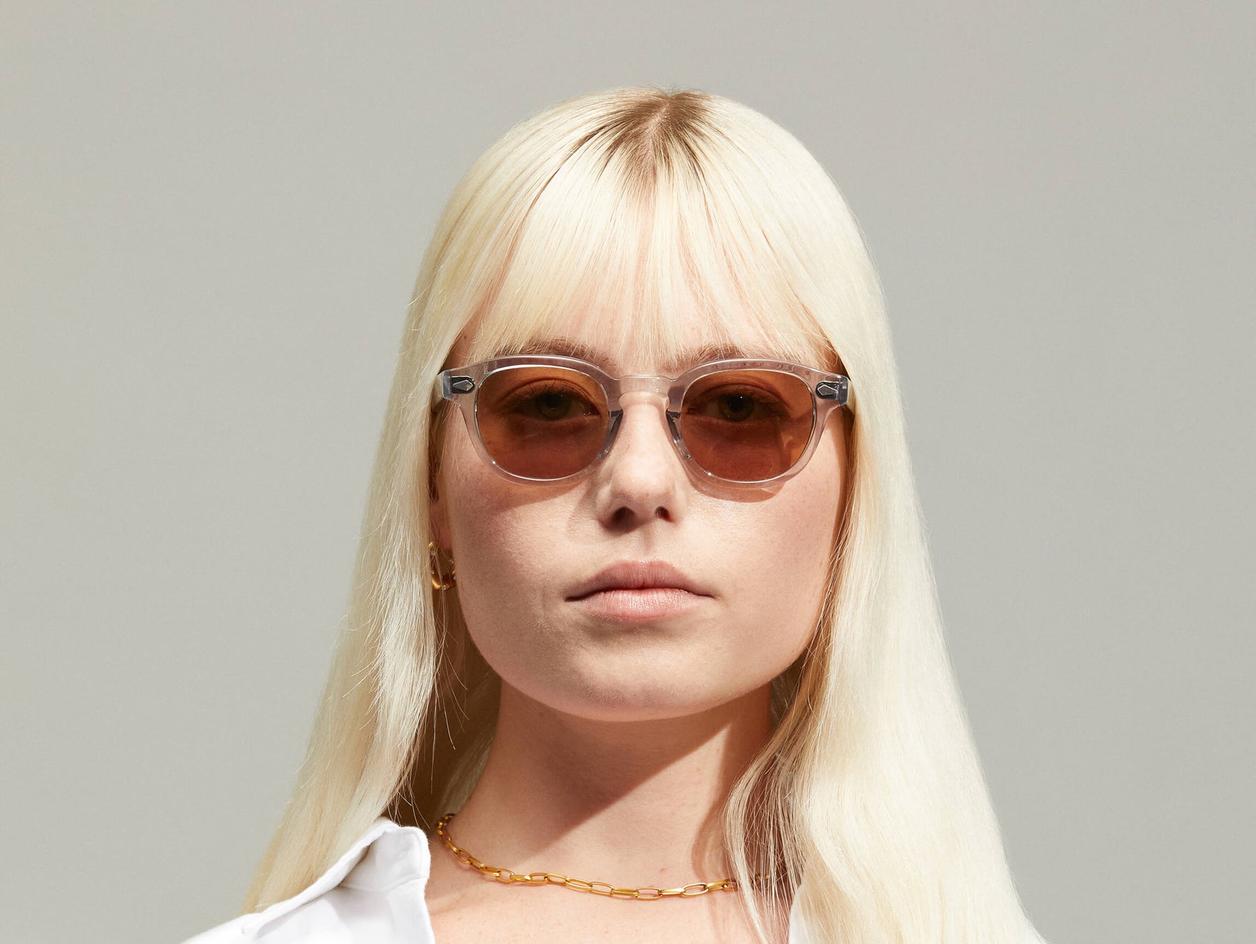 Model is wearing The LEMTOSH in Light Grey size 46 with AMBER+ Tinted Lenses