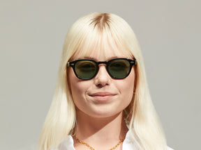 Model is wearing The LEMTOSH in Black size 46 with GREEN+ Tinted Lenses