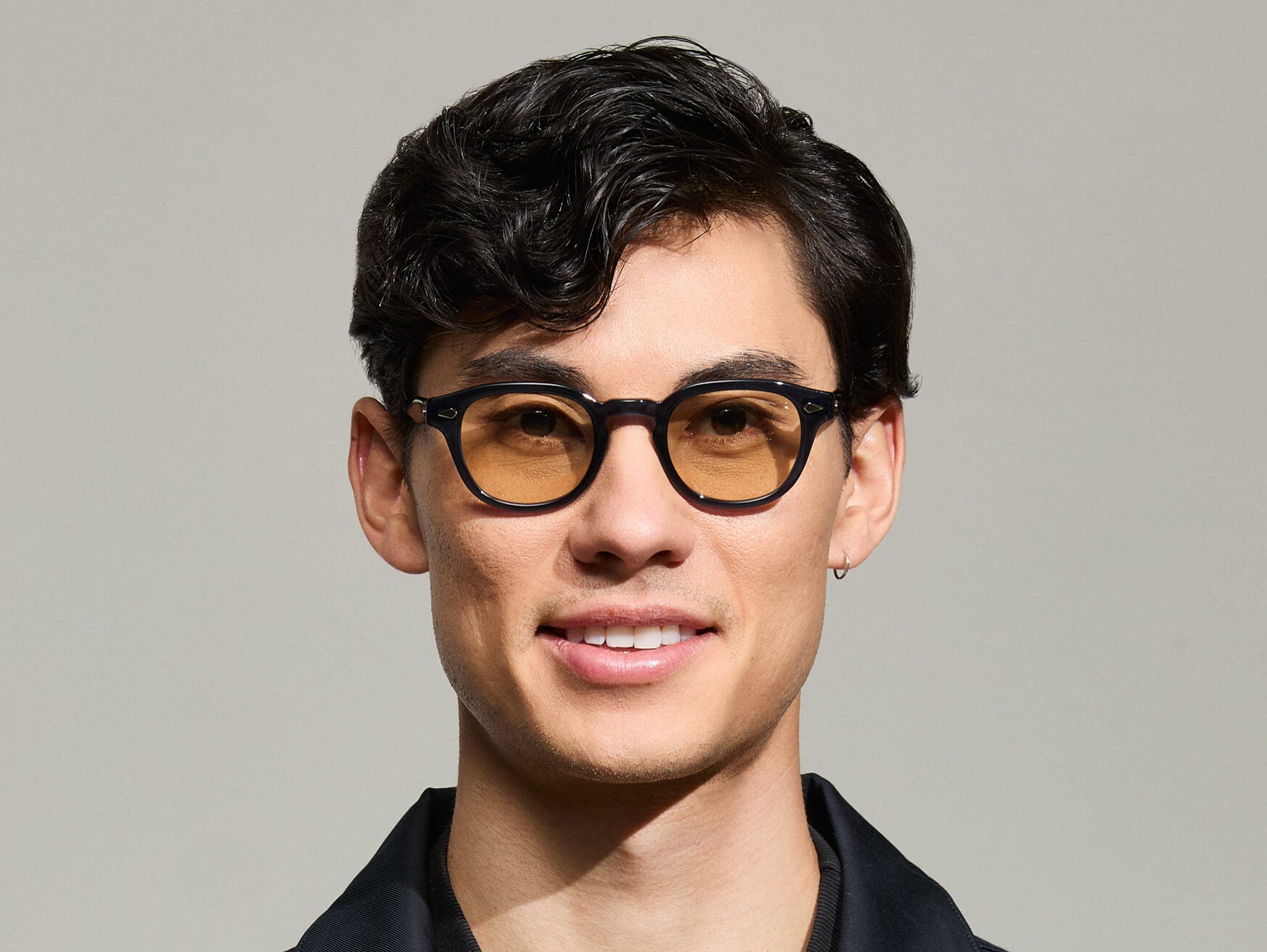 Model is wearing The LEMTOSH-TT 110 SUN in size 46 in Navy/Gold with BROWN+ Lenses