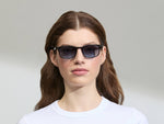 Model is wearing The LIKTIG SUN in size 53 in Black with Denim Blue Tinted Lenses