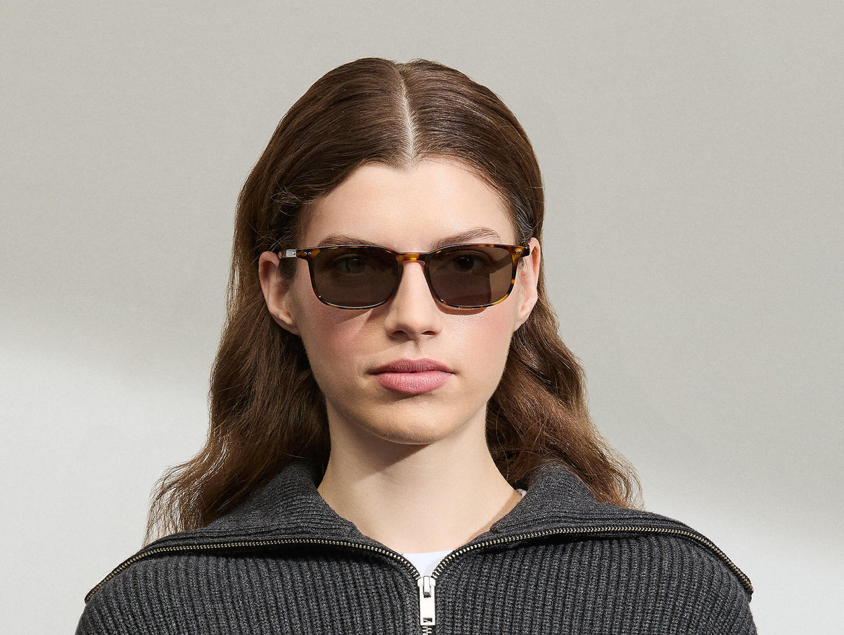 Model is wearing The LIKTIG SUN in size 53 in Spot Tortoise with G-15 Tinted Lenses