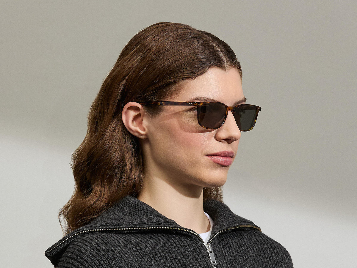 Model is wearing The LIKTIG SUN in size 53 in Spot Tortoise with G-15 Tinted Lenses