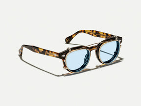 The MAYDELA CLIP in Gold with Bel Air Blue Tinted Lenses