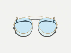 The MAYDELA CLIP in Gold with Bel Air Blue Tinted Lenses