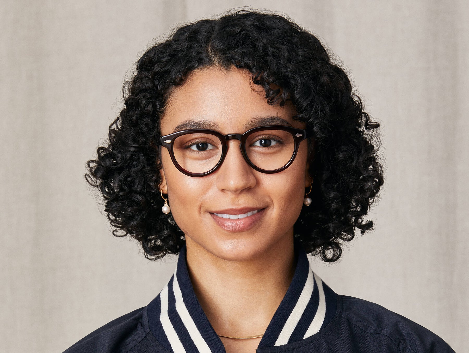 Model is wearing The MAYDELA in size 49 in Burgundy