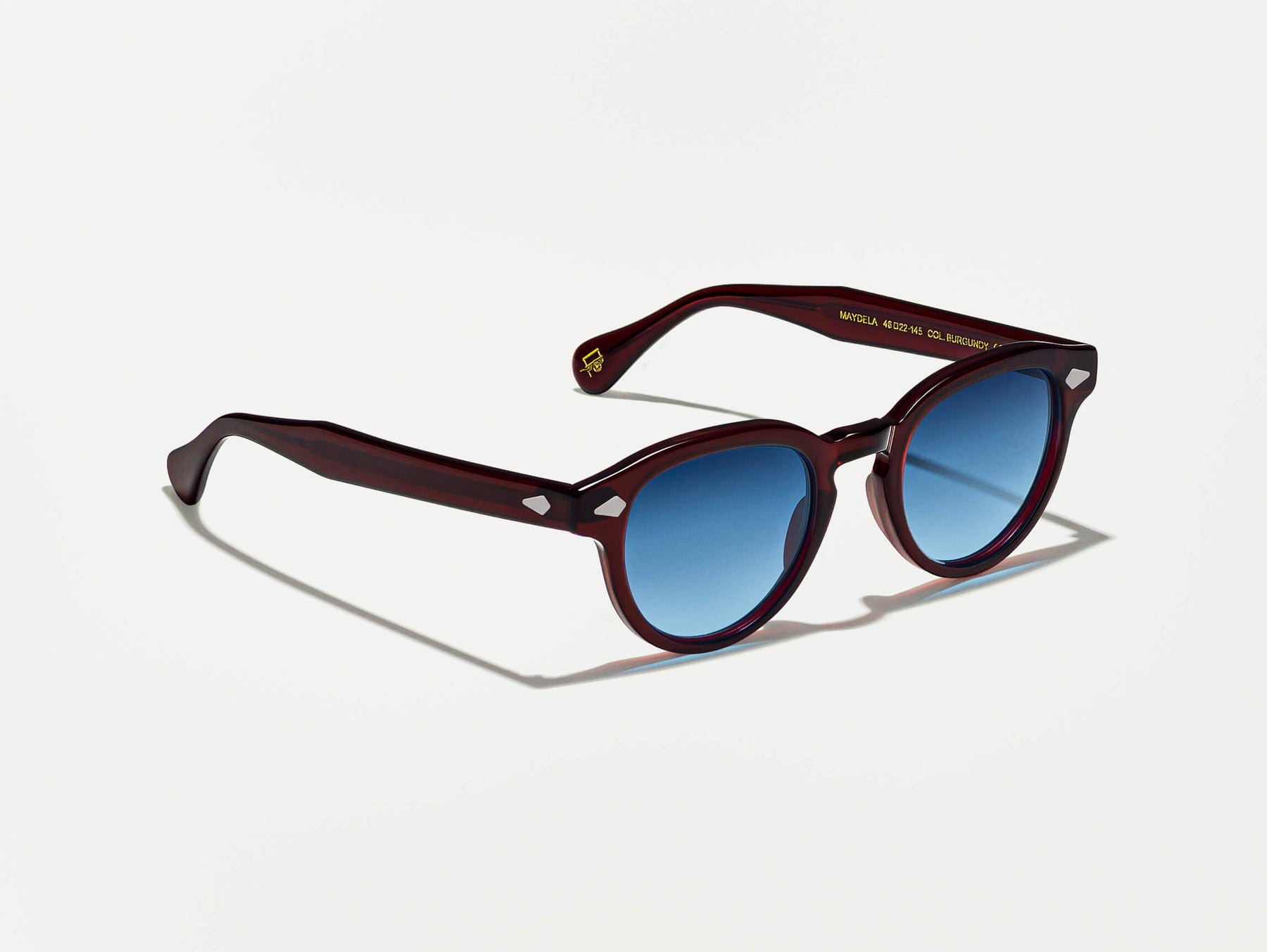 The MAYDELA SUN in Burgundy with Denim Blue Tinted Lenses
