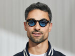 Model is wearing The MAYDELA SUN in Classic Havana in size 46 with Celebrity Blue Tinted Lenses