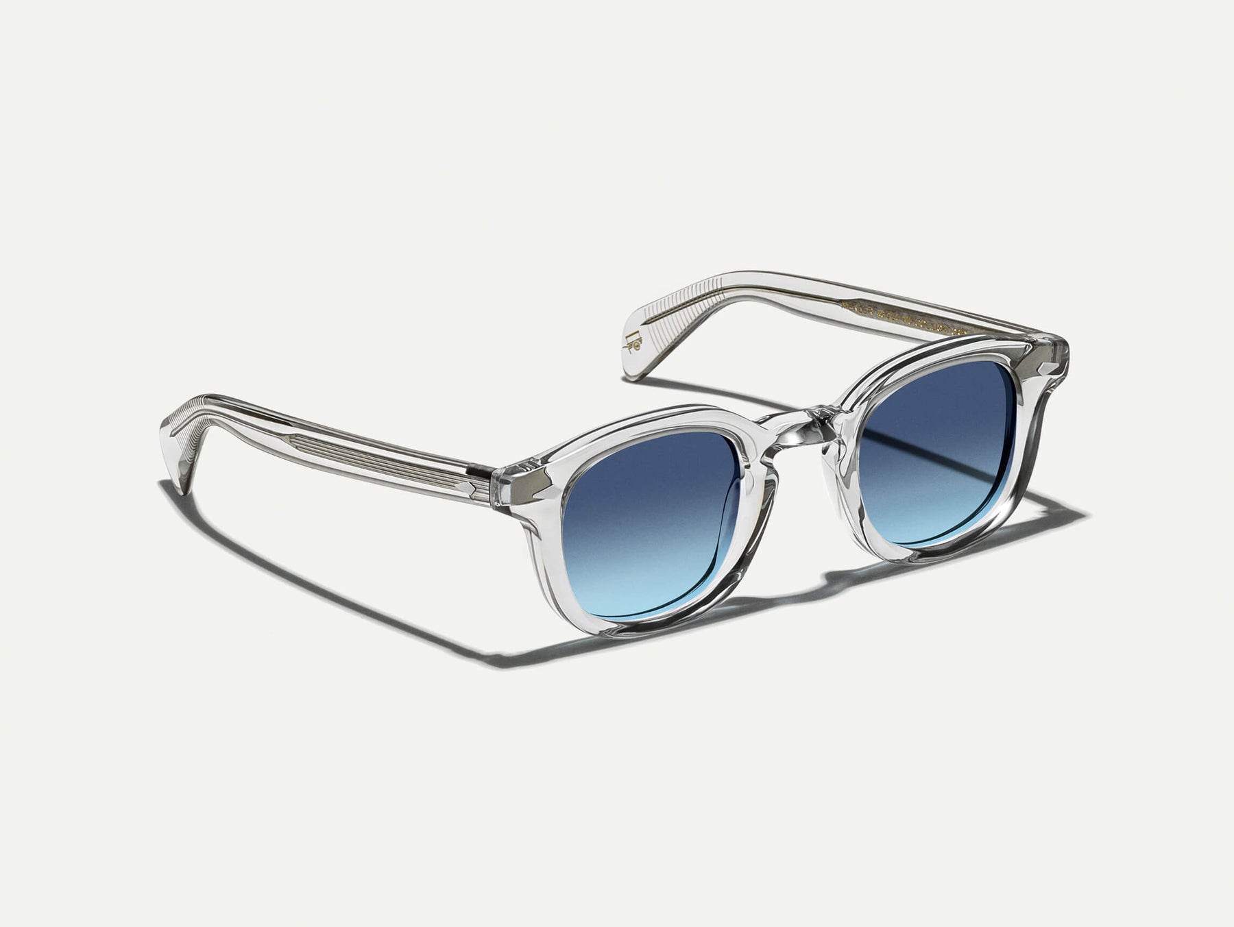 The MEKLER SUN in Light Grey with Denim Blue Tinted Lenses