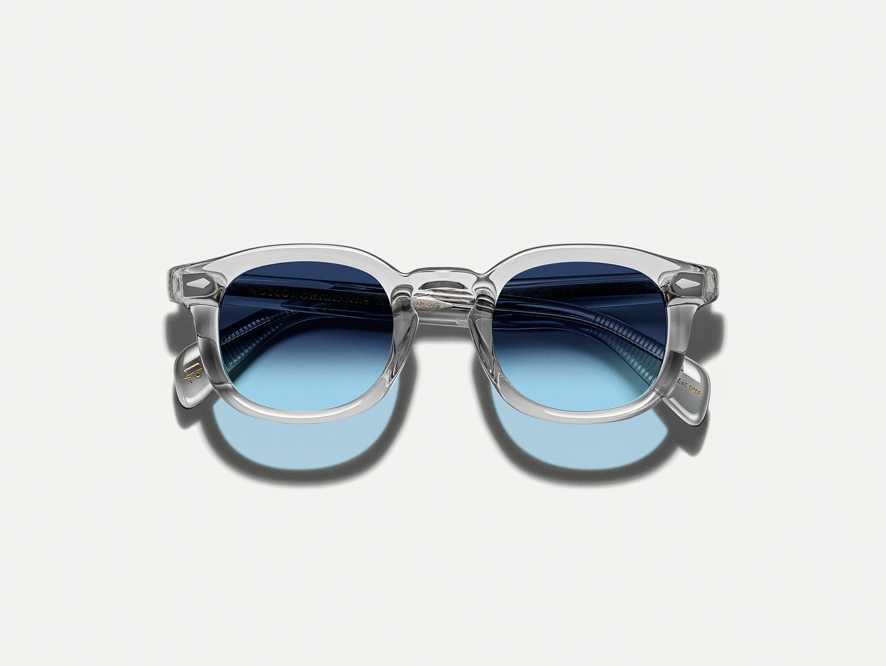 The MEKLER SUN in Light Grey with Denim Blue Tinted Lenses