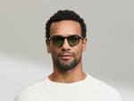 النموذج يرتدي MILTZEN in Black بالمقاس 46 مع عدسات GREEN+