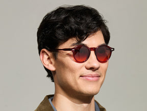 Model is wearing The MILTZEN in Ruby in size 46 with Cabernet Tinted Lenses