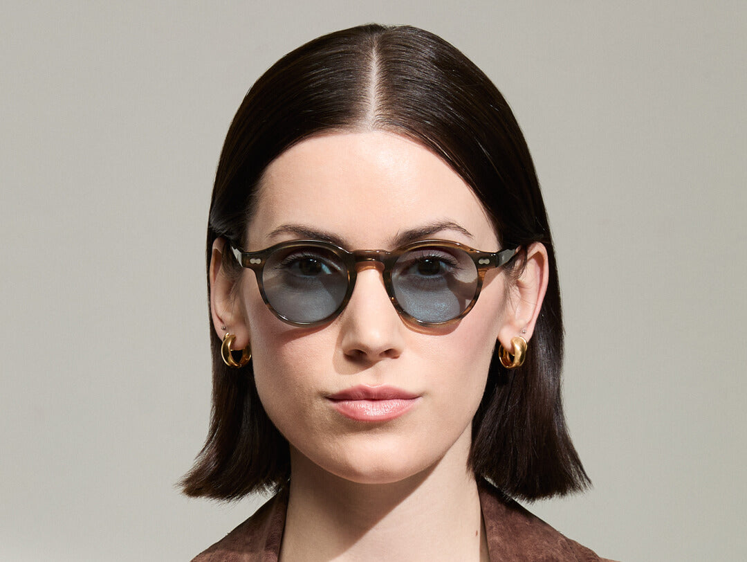 Model is wearing The MILTZEN in Bark in size 46 with Mineral Blue Tinted Lenses