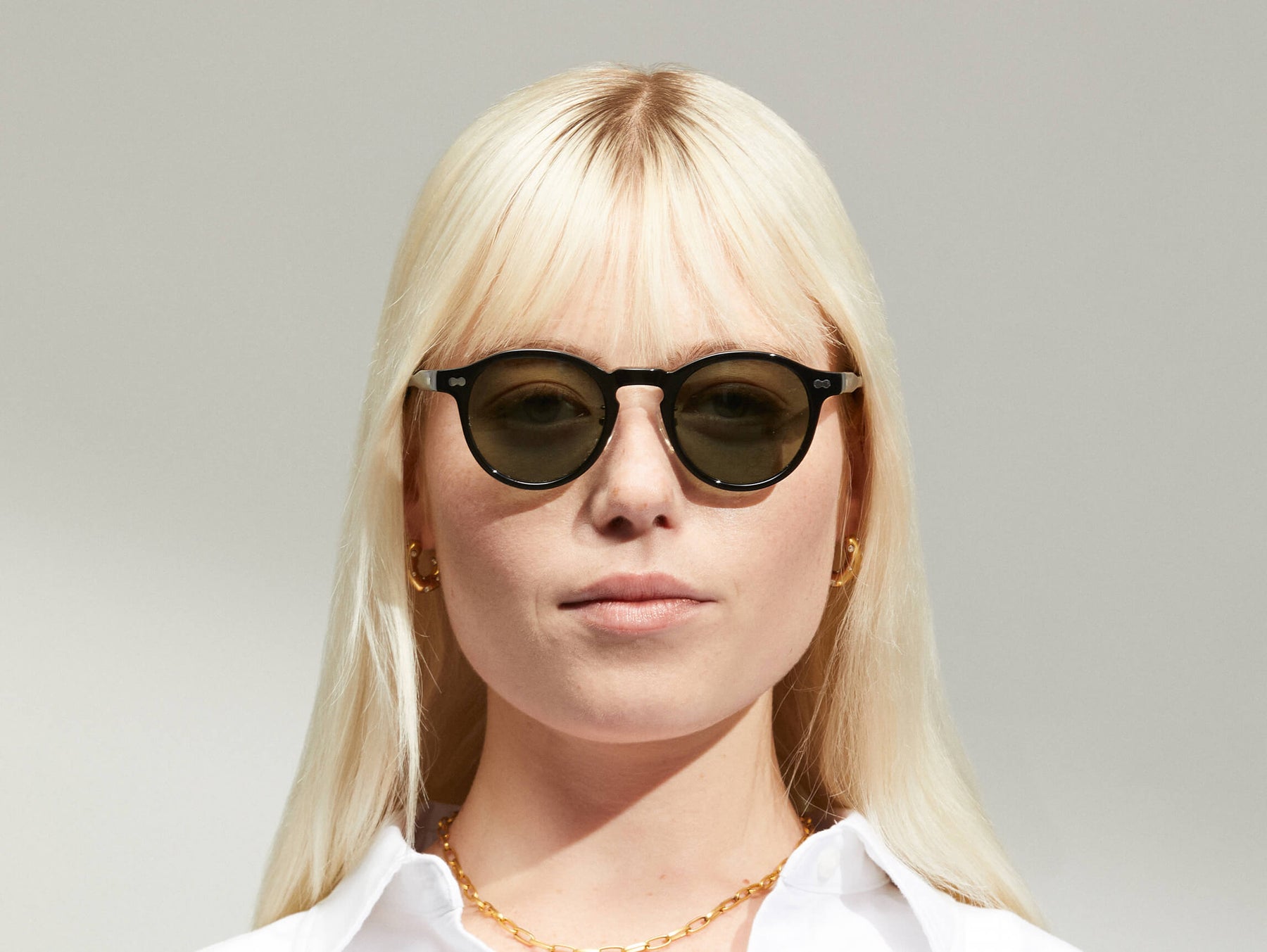 Model is wearing The MILTZEN SUN W/ METAL NOSE PADS in Black in size 46 with G-15 Glass Lenses