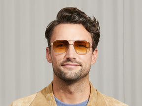 Model is wearing The MINGLE SUN in Gold in size 57 with Chestnut Fade Tinted Lenses