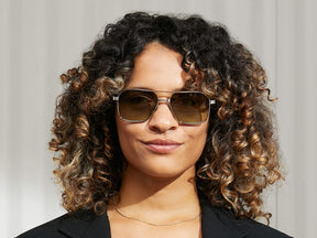 Model is wearing The MINGLE SUN in Silver in size 57 with Forest Wood Tinted Lenses