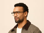 Model is wearing The MINYAN in size 54 in Grey-Brown Fade
