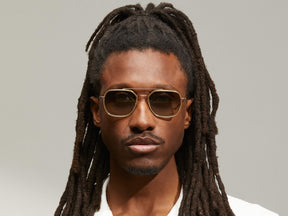 Model is wearing The MIZER SUN in size 54 in Flesh-Tortoise with Forest Wood Tinted Lenses