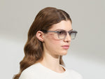 Model is wearing The MOMZA SUN in size 49 in Light Grey with American Grey Fade Tinted Lenses