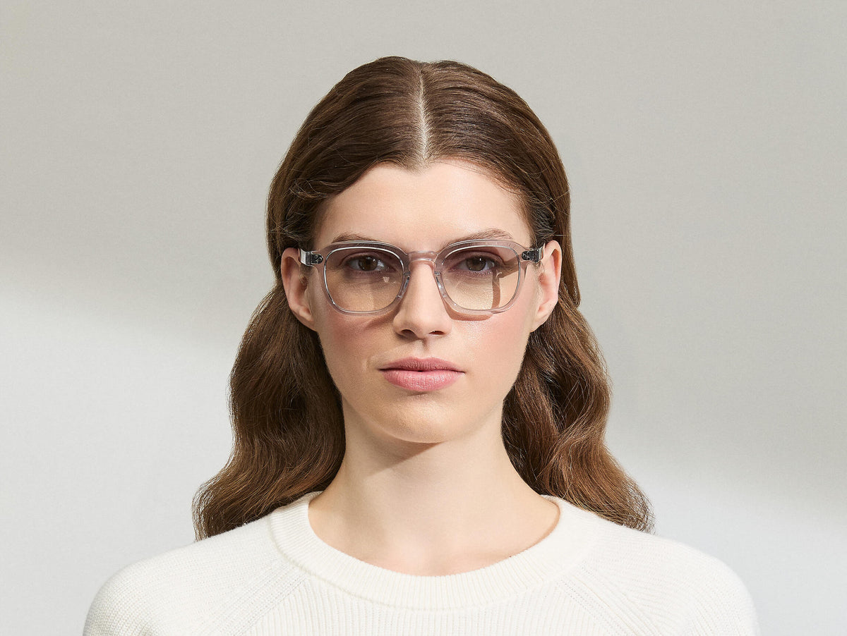 Model is wearing The MOMZA SUN in size 49 in Light Grey with American Grey Fade Tinted Lenses
