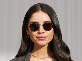 Model is wearing The MOSHA SUN in Tortoise/Gold in size 49 with G-15 Tinted Lenses