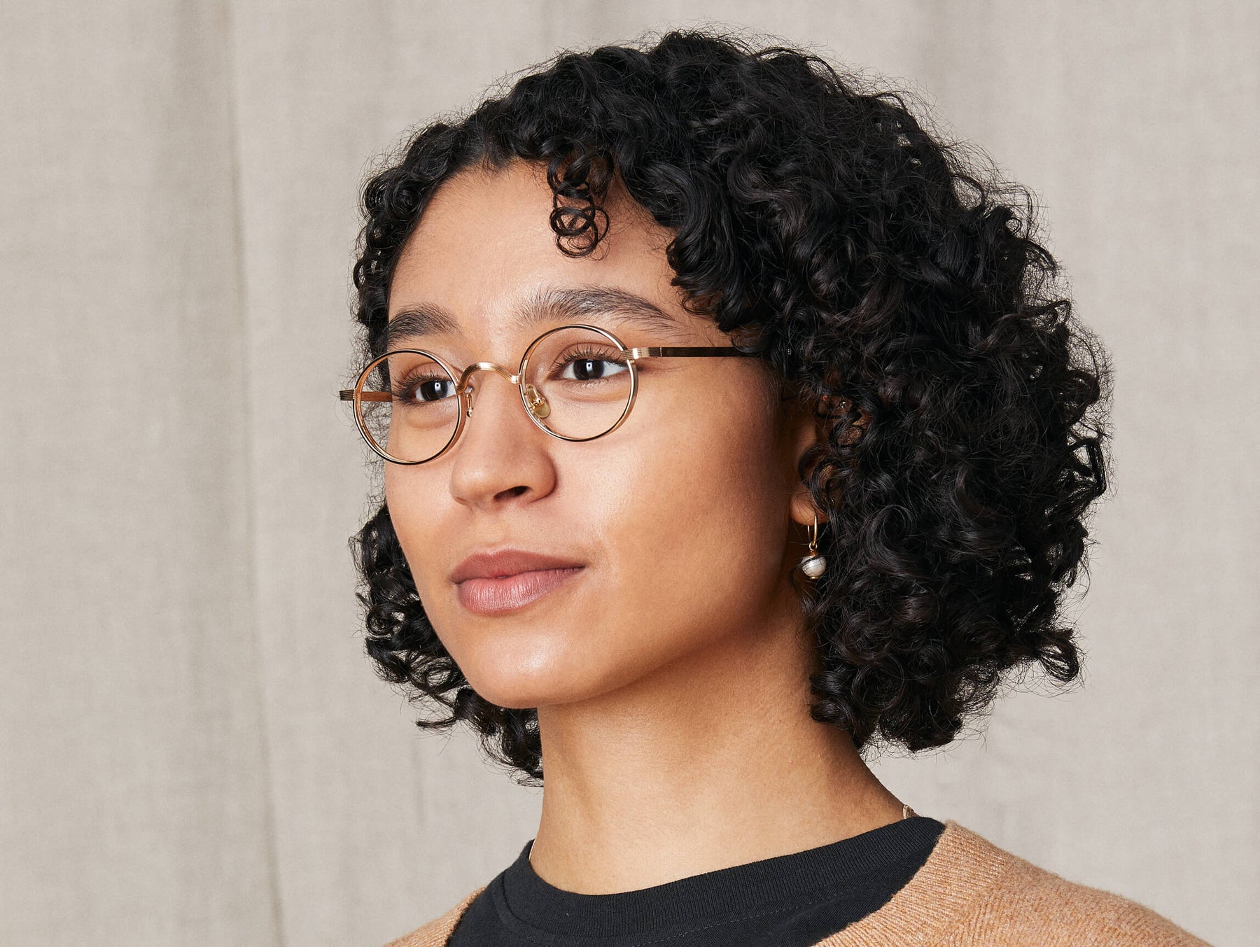 Model is wearing The MOYEL in size 44 in Gold