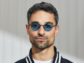 Model is wearing The MOYEL SUN in Navy in size 44 with Celebrity Blue Tinted Lenses