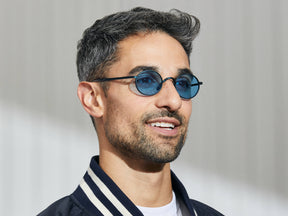 Model is wearing The MOYEL SUN in Navy in size 44 with Celebrity Blue Tinted Lenses