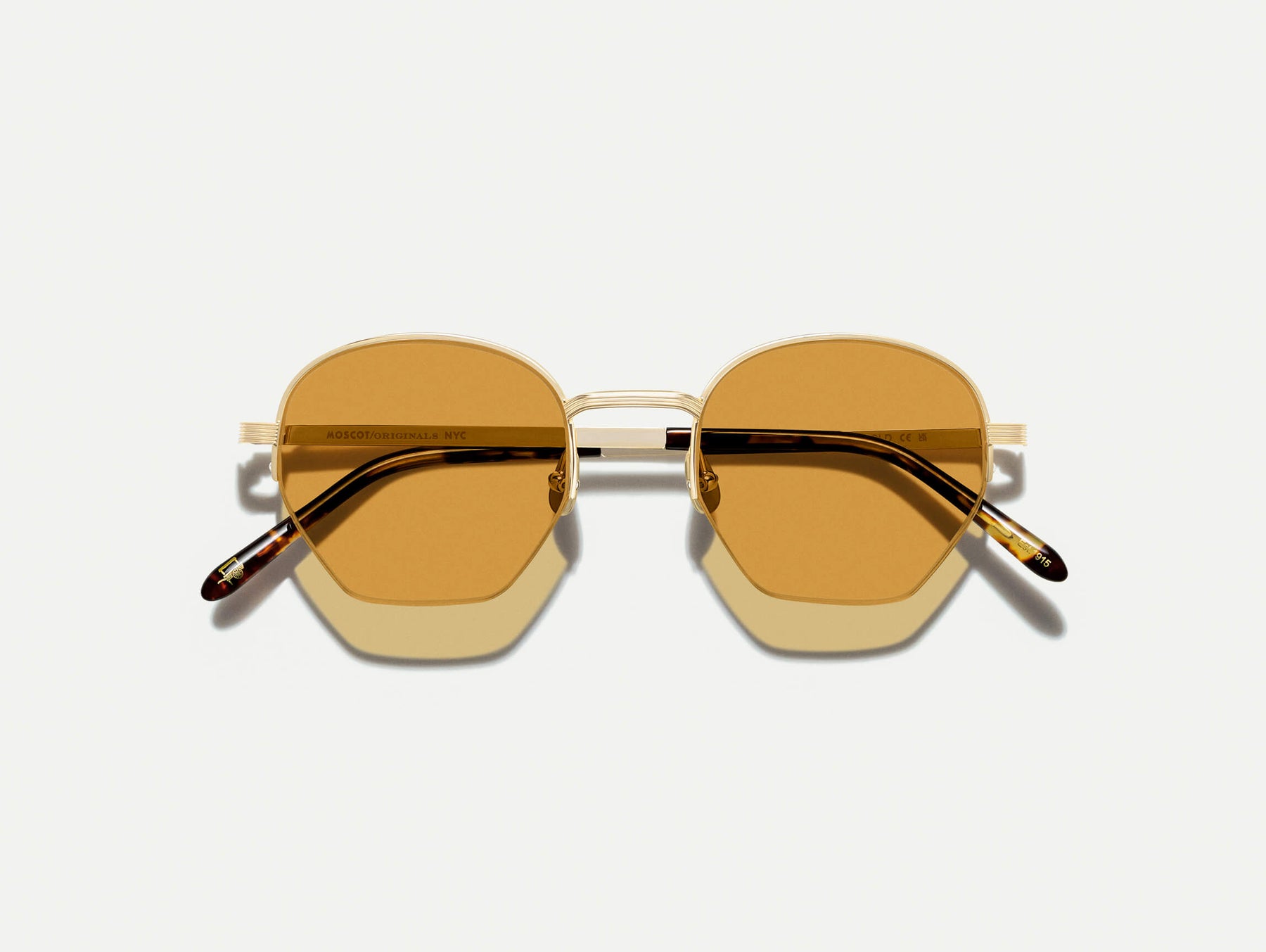 The PLOTZ SUN in Gold with Amber Tinted Lenses