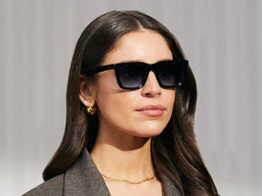 Model is wearing The RIZIK in Black in size 49 with Denim Blue Tinted Lenses