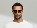Model is wearing The SHANEKITE SUN in Black in size 49 with Cabernet Tinted Lenses