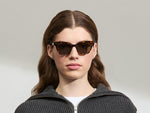 Model is wearing The SHANEKITE SUN in Classic Havana in size 49 with G-15 Tinted Lenses
